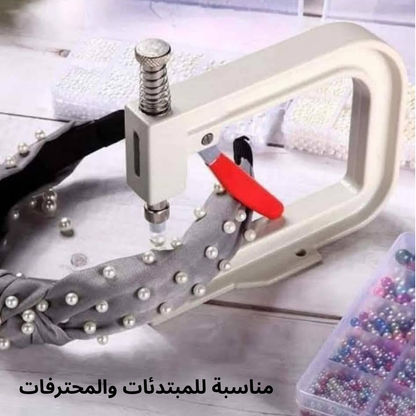 آلة يدوية لتزيين الملابس
